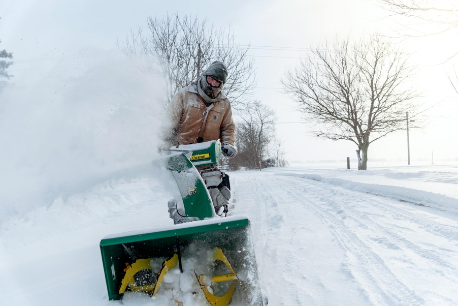 Cleared driveway and walkway after a snowstorm by Williams' Complete Lawncare